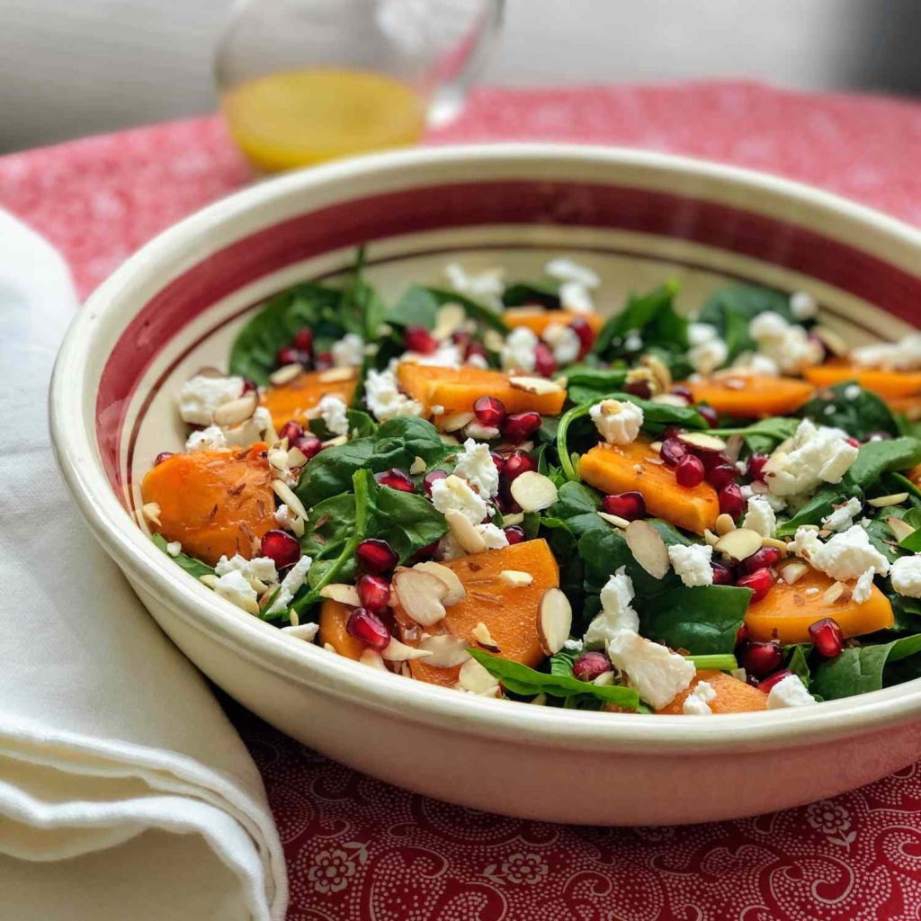 Receta Ensalada de espinacas y caquis con queso de cabra y granada.
